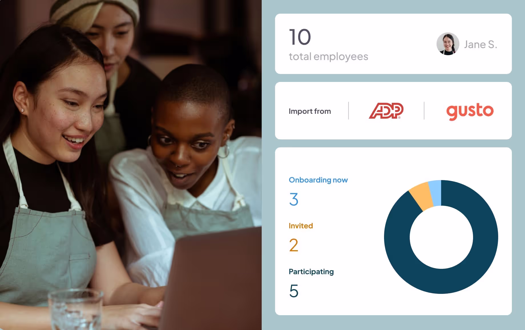 A group of women sitting at a table working on a laptop